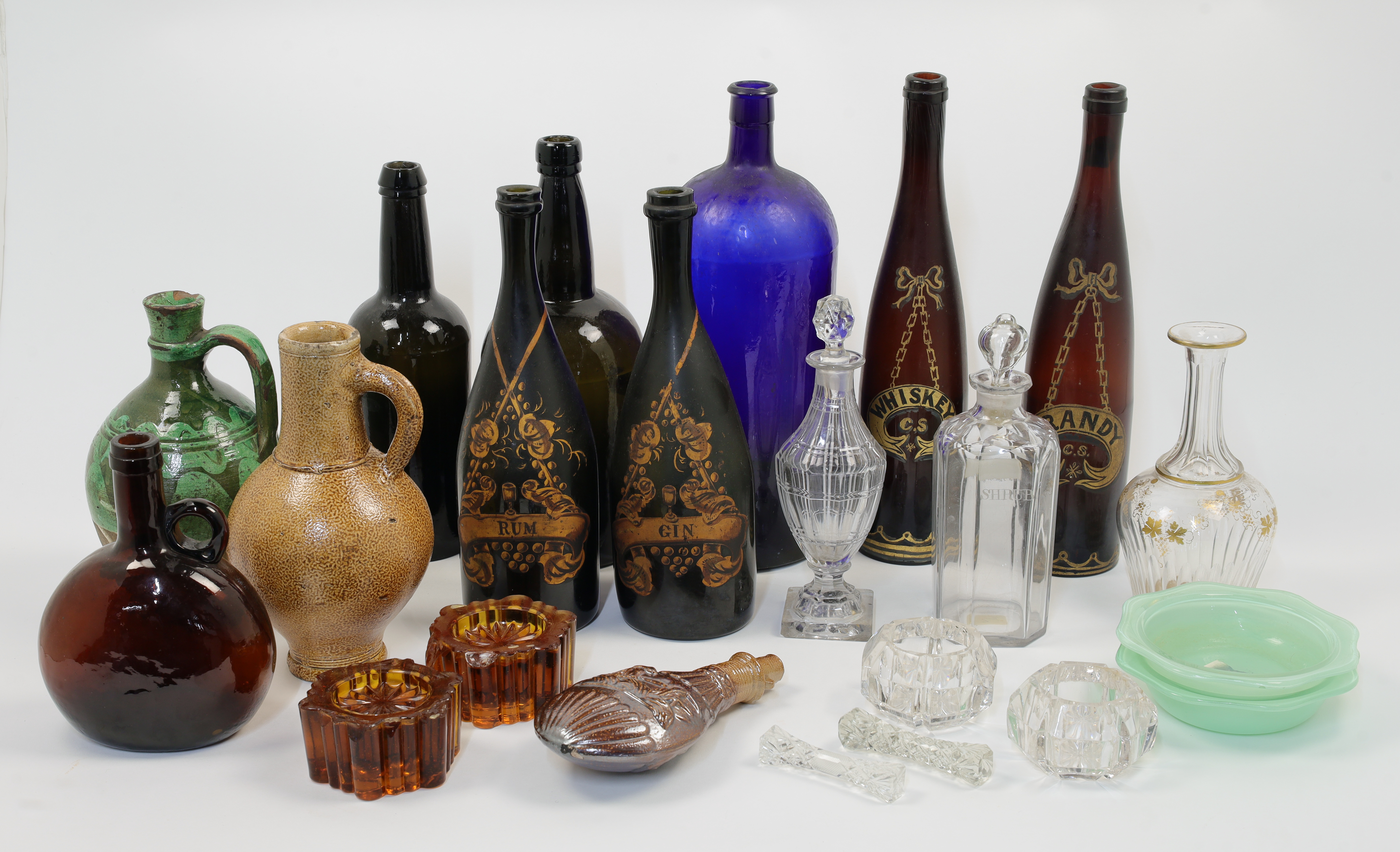 A mixed group of clear and coloured glass bottles and ornaments, 18th - 19th centuries, comprisin...
