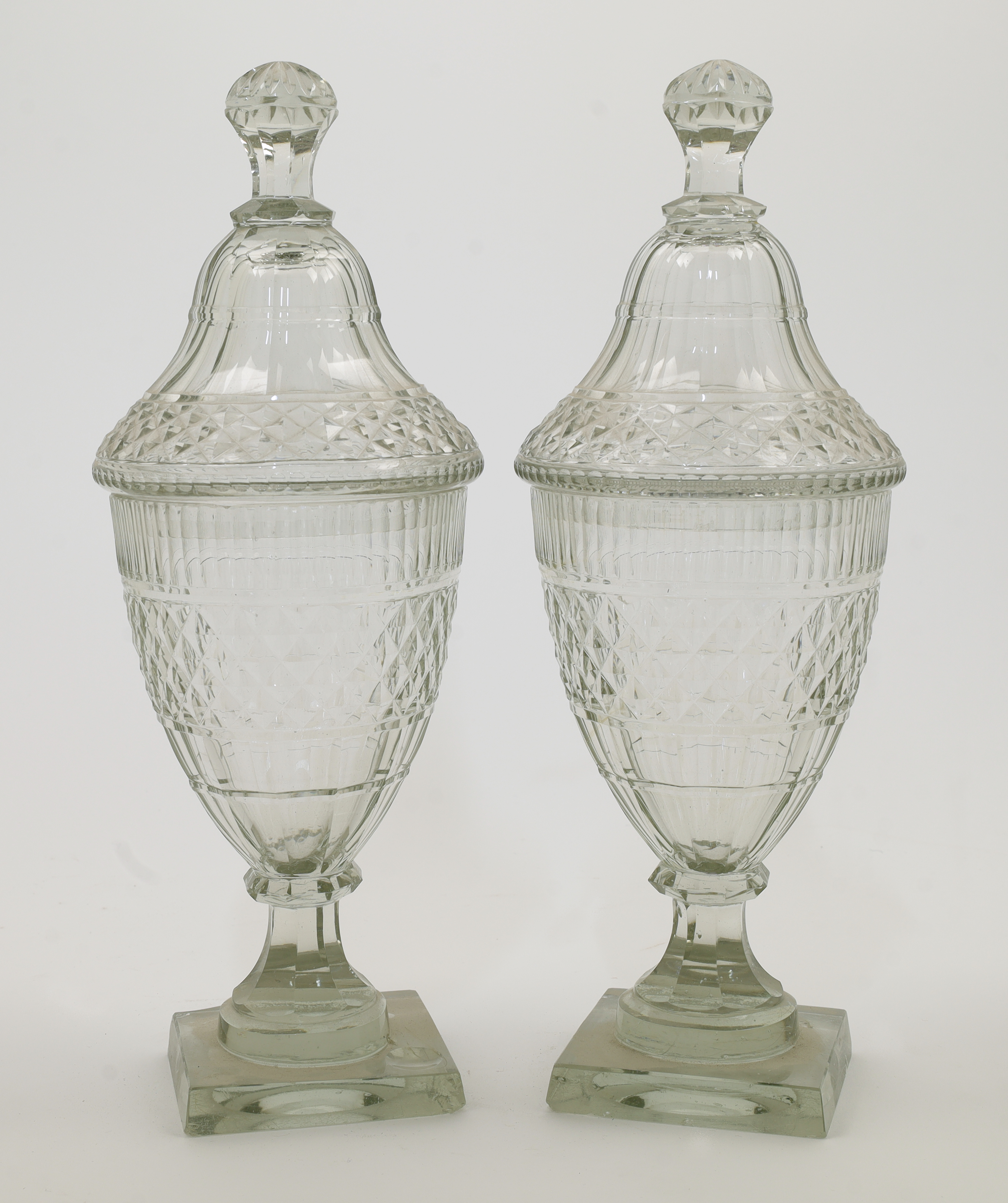 A pair of Regency style hobnail cut sweetmeat glass jars and covers, 20th century, each with knop...