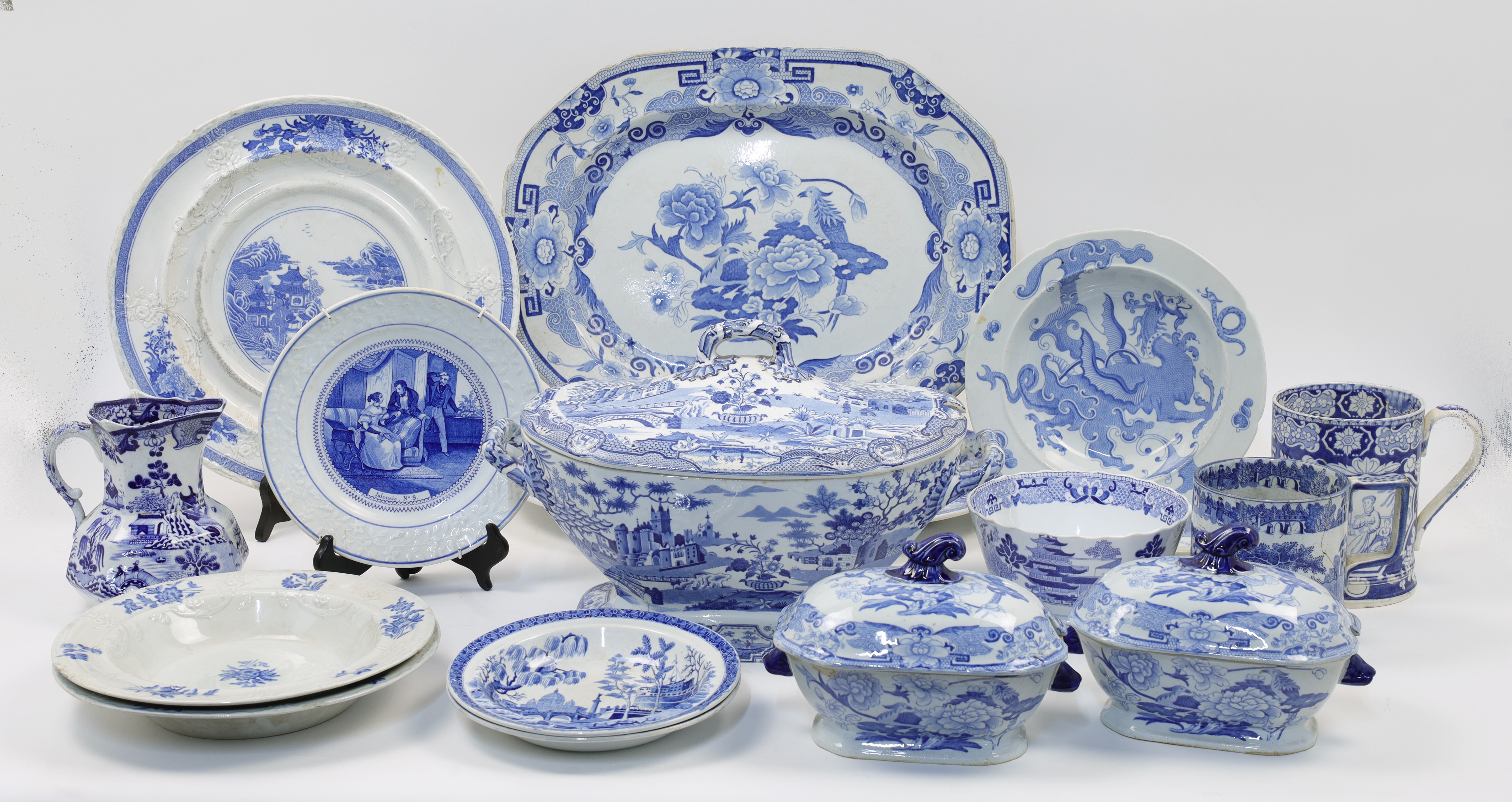 A quantity of blue and white transfer-print decorated ceramics, 19th century, comprising: a group...