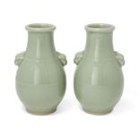 A pair of Chinese celadon-glazed pear-shaped vases with mythical beast handles, Republic period /...