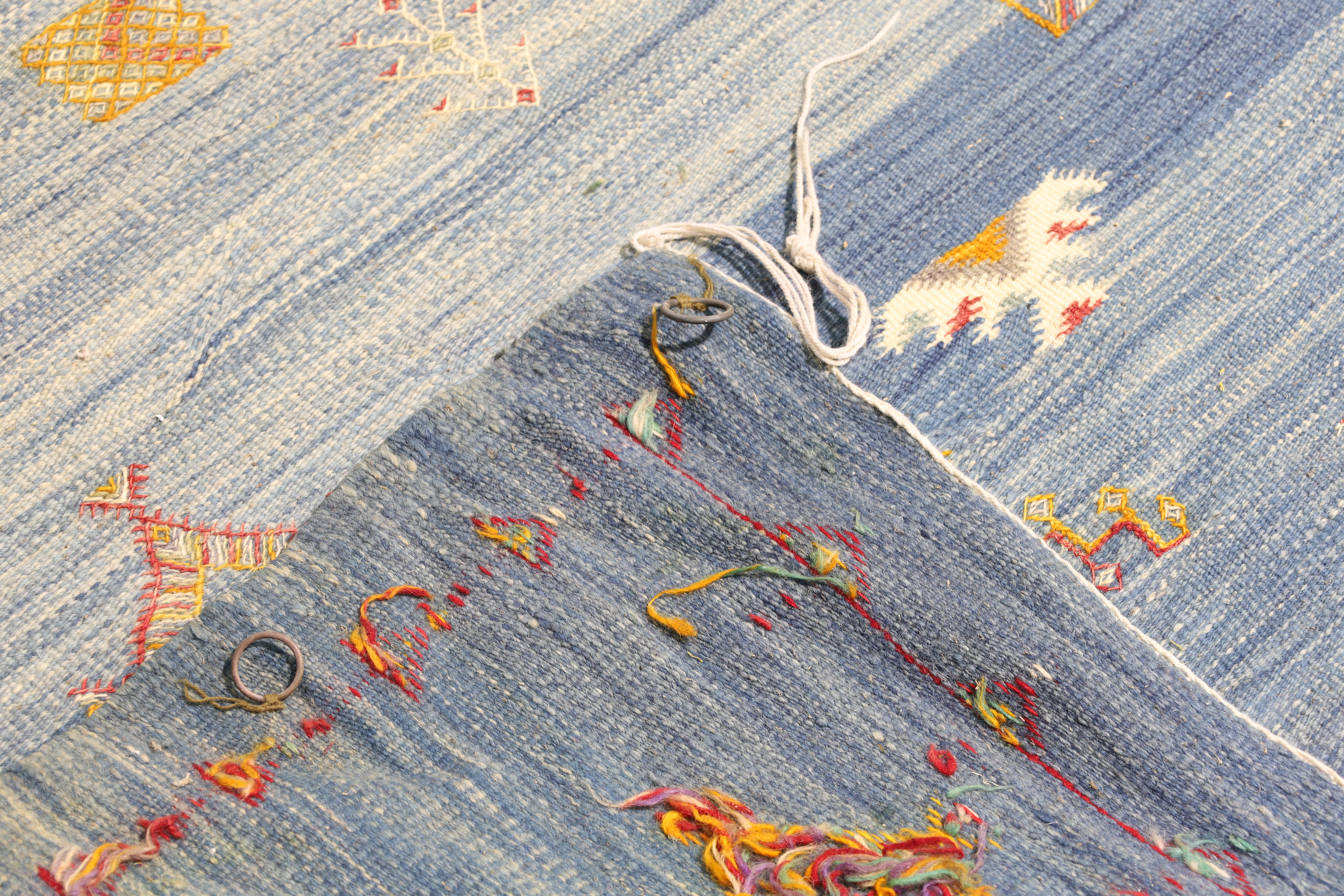 A Moroccan flatweave carpet, last quarter 20th century, geometric motifs, on a blue ground, 301 x... - Image 4 of 4