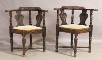 A pair of Victorian carved oak corner chairs, second quarter 19th century, (2)