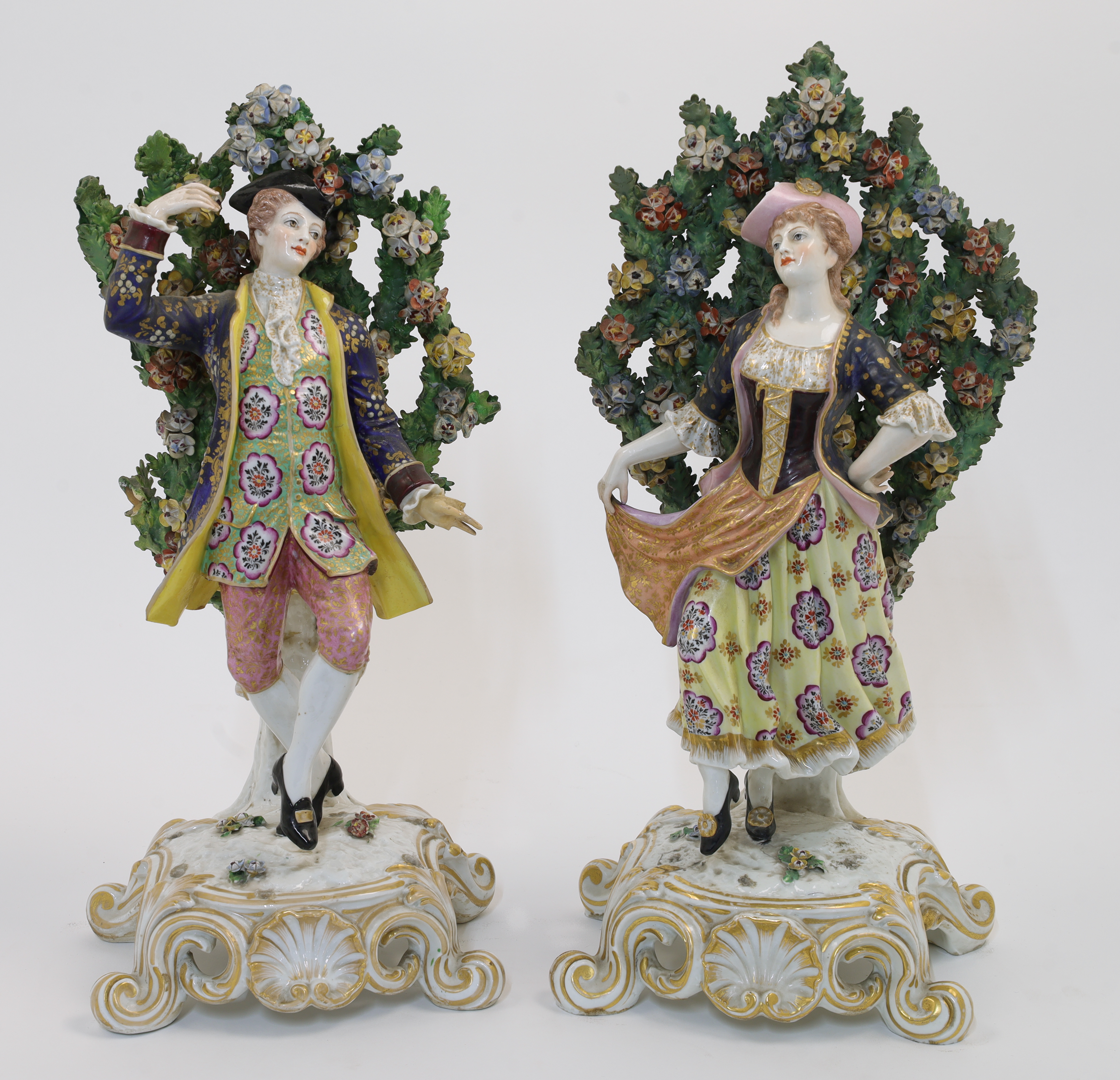 A pair of large Derby style bocage figures, possibly Samson, second half 19th century, pseudo red...