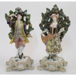 A pair of large Derby style bocage figures, possibly Samson, second half 19th century, pseudo red...