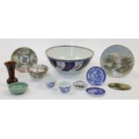 A mixed group of Chinese and Japanese porcelain, 20th century, comprising: a punch bowl with swir...