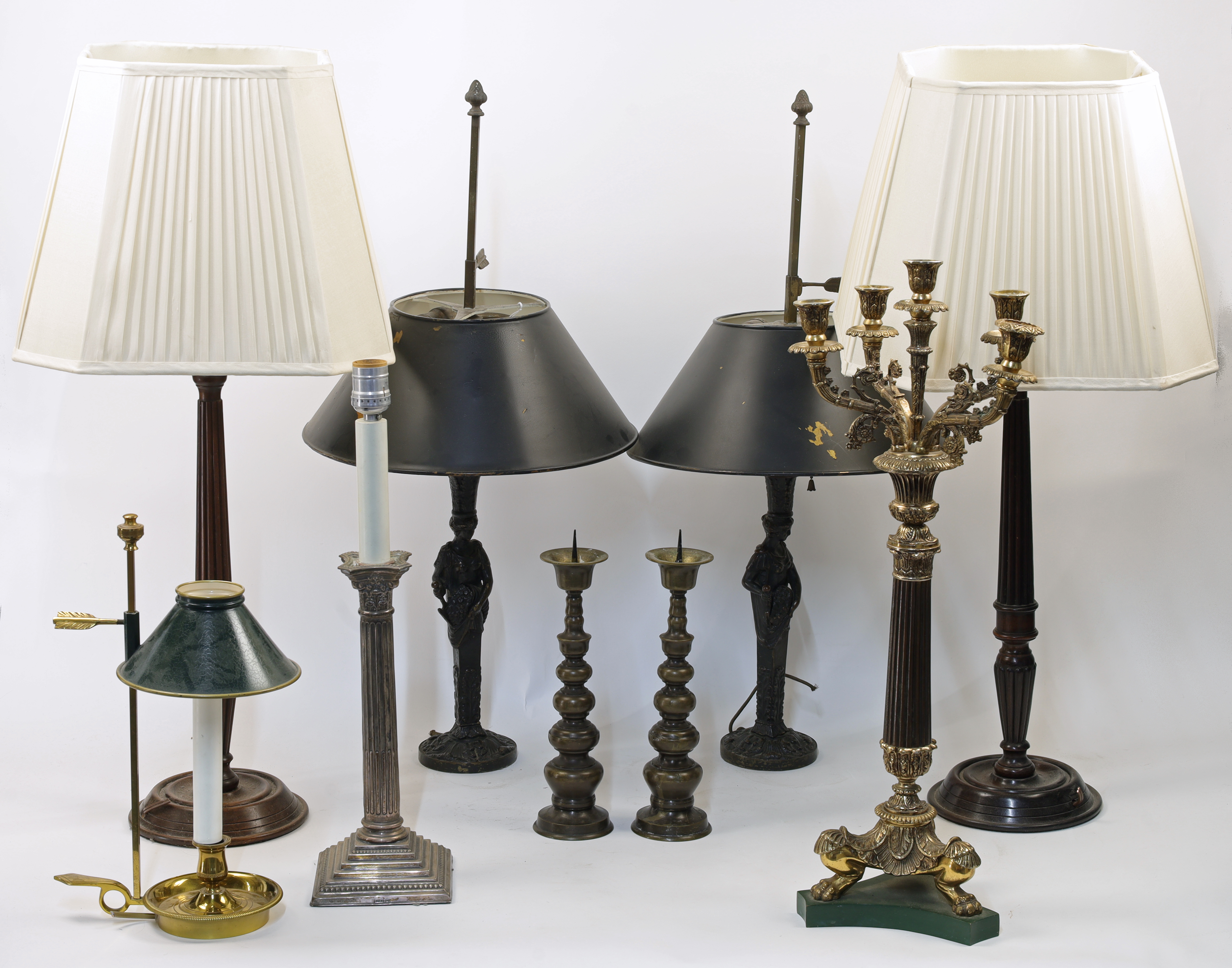 A group of various table lamps, 20th century, comprising: a pair of mahogany turned wood candlest...