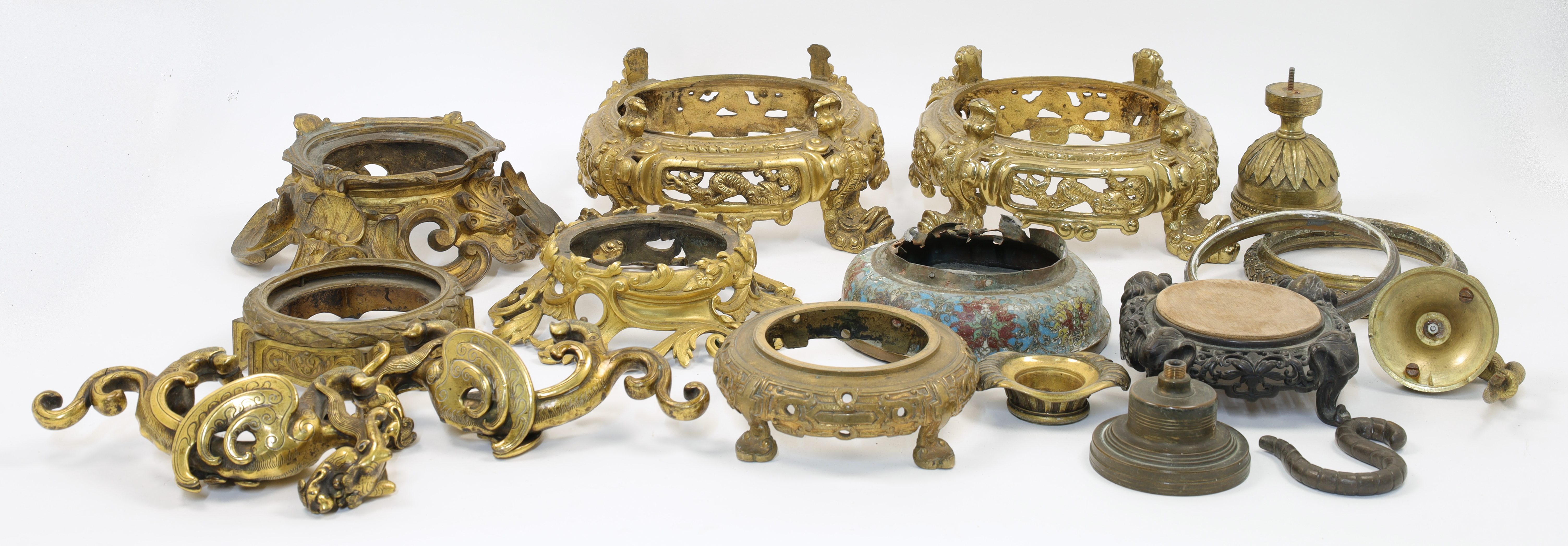 A collection of mounts and stands for Chinese porcelain, gilt metal, cloisonne and carved hardwoo...