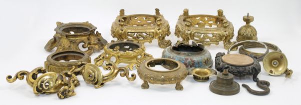 A collection of mounts and stands for Chinese porcelain, gilt metal, cloisonne and carved hardwoo...
