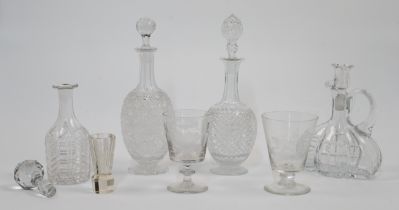 A group of cut glass decanters and goblets, 19th - 20th centuries, comprising: a quadrilobed deca...