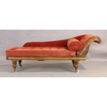 A Victorian mahogany chaise longue, third quarter 19th century, on turned legs to brass caps and ...