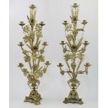 A pair of French gilt brass candelabra, late 19th century, each with seven sconces on branches is...