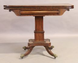 A Regency mahogany tea table, first quarter 19th century, the fold over top above carved frieze, ...