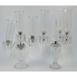 Two cut and moulded glass three-light candelabras with glass shades, 20th century, the first of S...