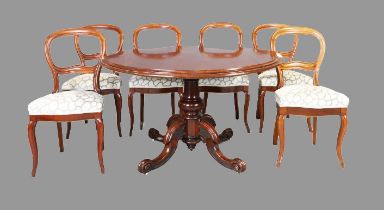 A Victorian mahogany breakfast table and a set of six Victorian mahogany balloon back chairs (7)
