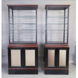 Two modern bespoke made ebonised cabinets, 230cm high, 100cm wide, 49cm deep (largest), 230cm hig...