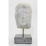 An Art Deco style carved marble head of a young male, 20th century, with long curling hair, on a ...