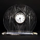 A Lalique clear and frosted ‘Iris’ timepiece, c.2003, etched Lalique ® France to integral ellipti...