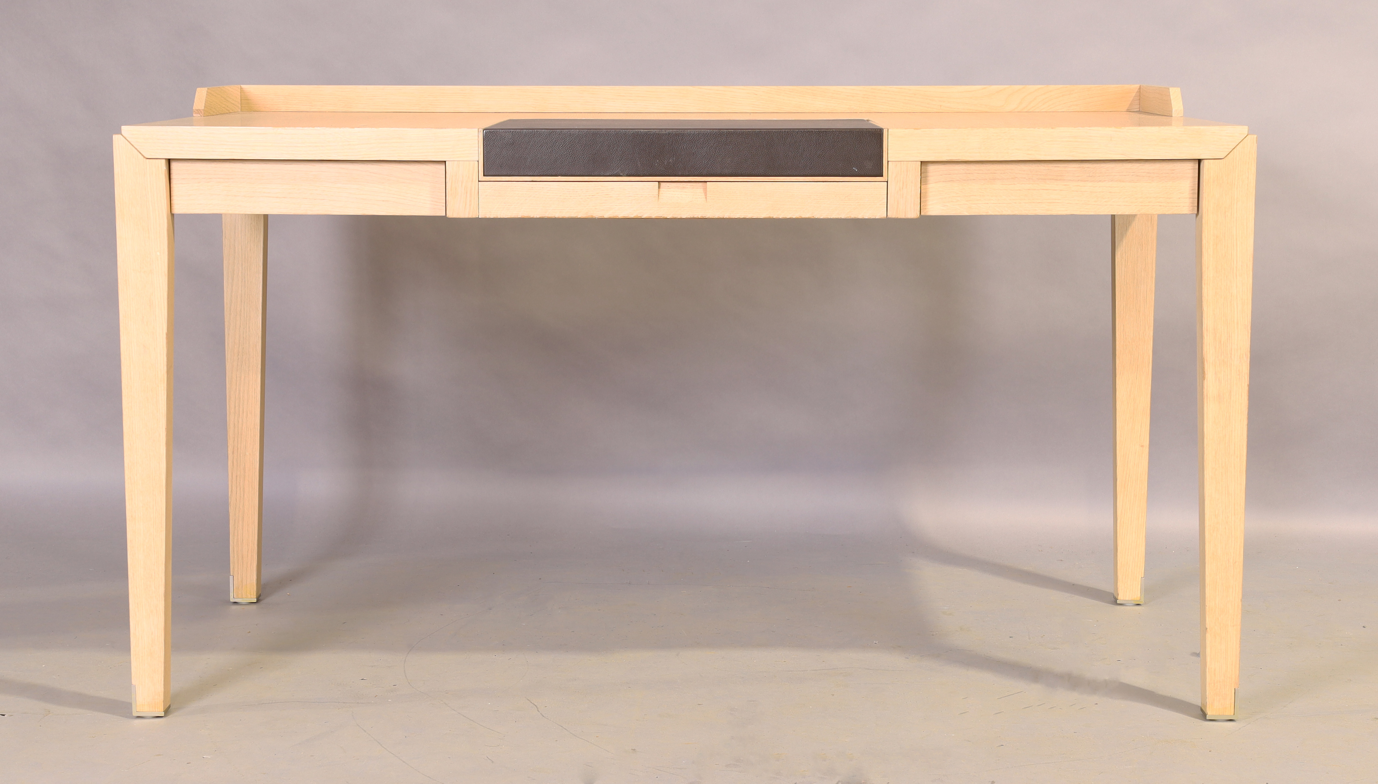 A contemporary desk, with hinged leather writing surface, revealing compartment, over single draw... - Image 3 of 3