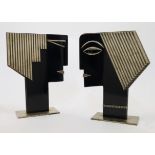 After Franz Hagenauer, two stylised busts, second half 20th century, in ebonised wood and plated ...