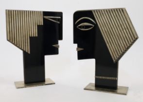 After Franz Hagenauer, two stylised busts, second half 20th century, in ebonised wood and plated ...