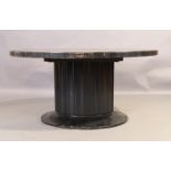 A modern ebonised dining table by Ralph Lauren, the oval top with sliding mechanism, on fluted su...
