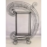 A wrought iron shelving unit, last quarter 20th century, of C-scroll form, 195cm high, 142cm wide...