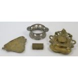 A group of Art Nouveau metalwares, comprising a brass inkwell with maiden's head and lily pads ma...