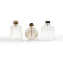 Two Chinese rock crystal snuff bottles and one translucent glass imitating crystal snuff bottle ...