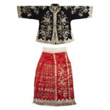 A Chinese embroidered wedding robe jacket and skirt 1930s Comprising a slim-sleeve jacket of bl...