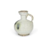 A Chinese Jun-type wine ewer  Yuan/Ming dynasty The greyish stoneware body covered in a thick c...