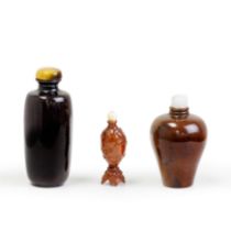 A Chinese carved hediao snuff bottle and two lacquered wood snuff bottles Qing dynasty, 18th cen...