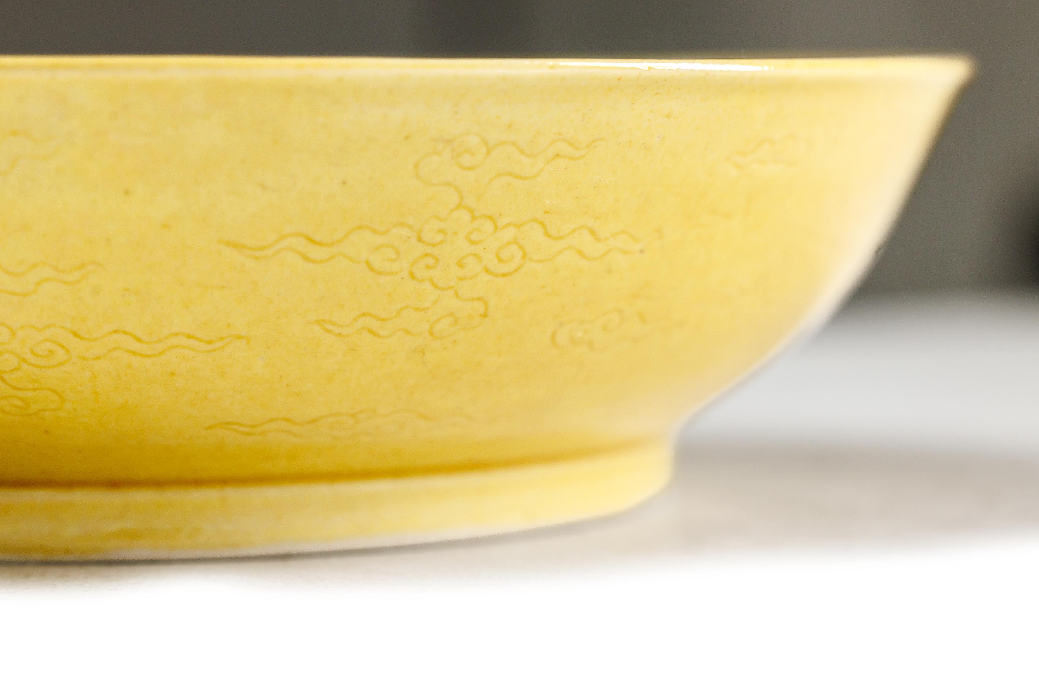 A Chinese yellow glazed 'dragon' dish Qing dynasty, Daoguang mark and period The deep dish with... - Image 4 of 7