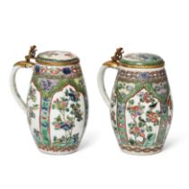 A rare pair of Chinese famille verte tankards and covers Qing dynasty, Kangxi period Painted to...