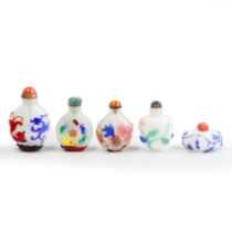 Five Chinese overlay snuff bottles 20th century Comprising: a blue overlay on white glass melon...