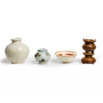 A group of four Chinese ceramic vessels Five dynasties - 20th century Comprising a white-glazed...