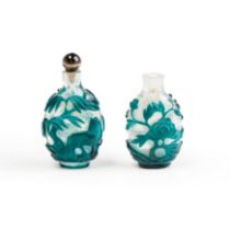 Two Chinese green overlay translucent glass snuff bottles Late Qing dynasty The first, carved w...