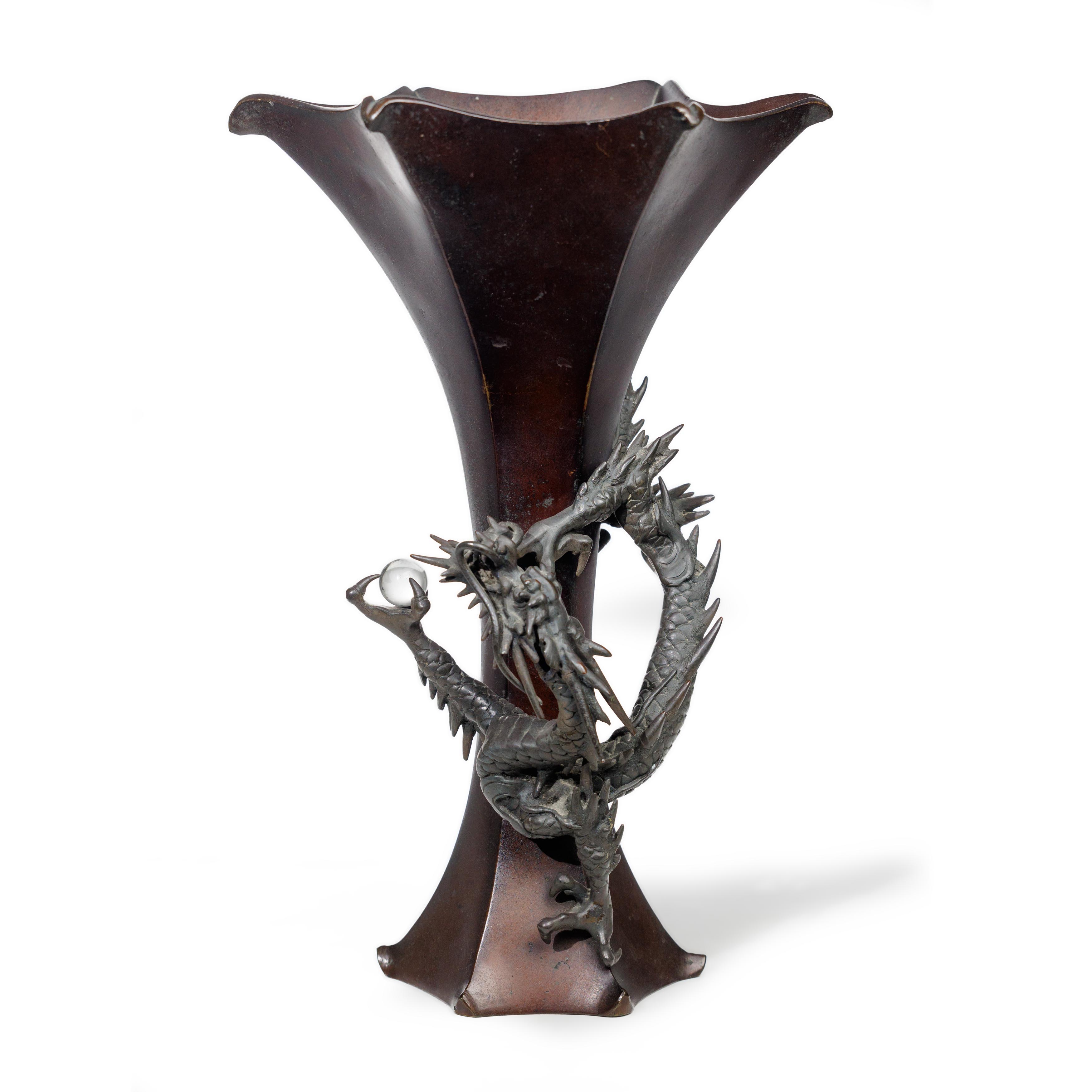 A Japanese bronze 'dragon' beaker vase Meiji period Of hexagonal form, the slender body with sp...