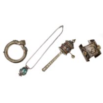 Four Tibetan white metal implements First half of 20th century Comprising: a prayer wheel mount...