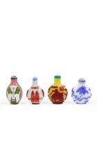 Four Chinese overlay glass snuff bottles Late Qing dynasty-20th century Comprising: a blue over...