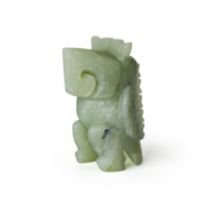 A Chinese archaistic green jade standing parrot 20th century With stylised scrolling angular mo...