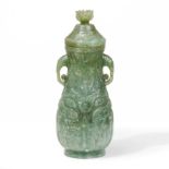 A Chinese jade archaistic twin-handled pear-shaped bottle vase and cover Qing dynasty, 18th/19th...