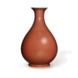 A Chinese copper-red-glazed pear-shaped vase, yuhuchun Qianlong seal mark and of the period Wel...