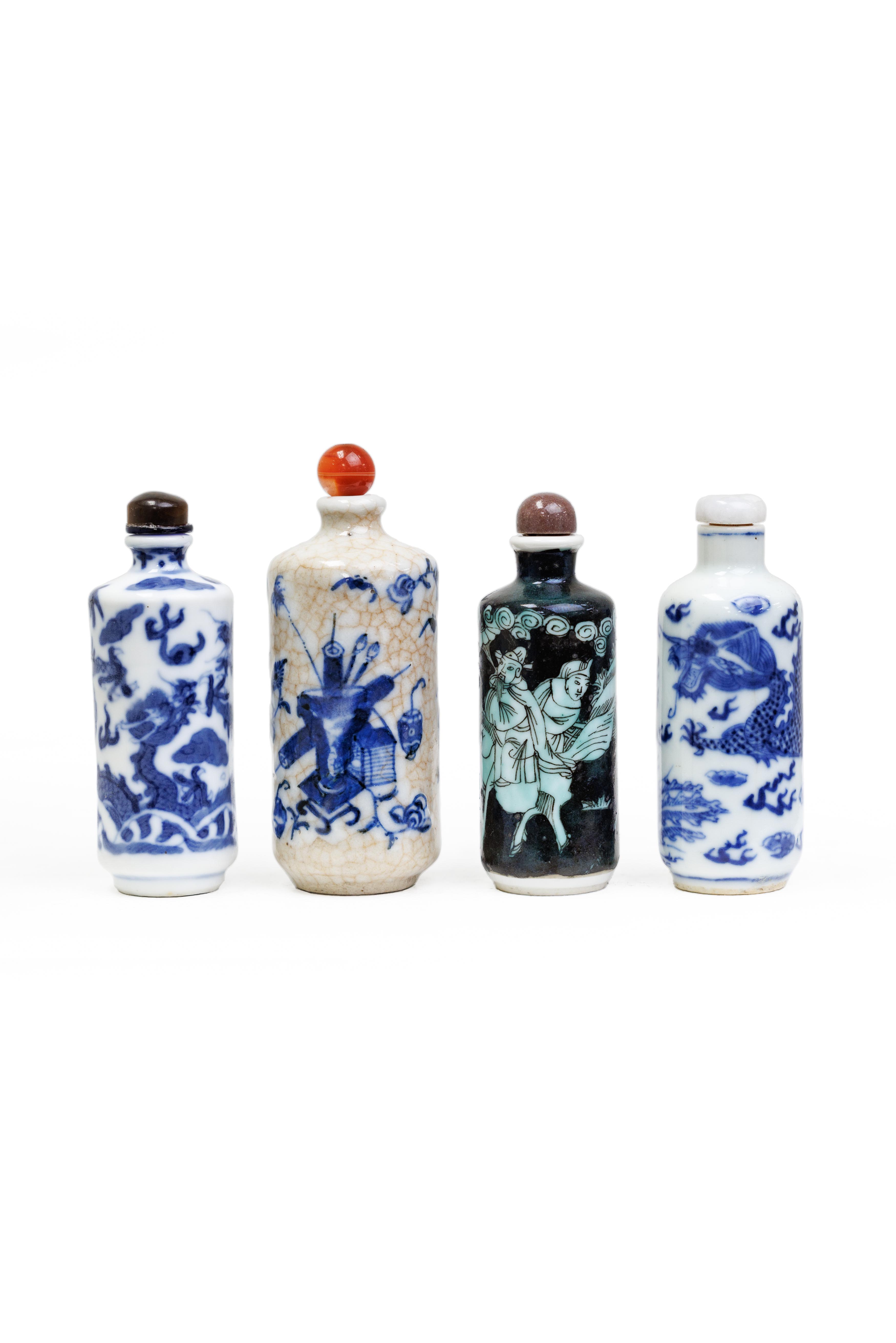 Four Chinese cylindrical snuff bottles Qing dynasty, 19th/20th century  Comprising: a blue and ...