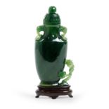 A small Chinese spinach jade 'lingzhi' vase and cover Mid Qing dynasty The even, dark green sto...