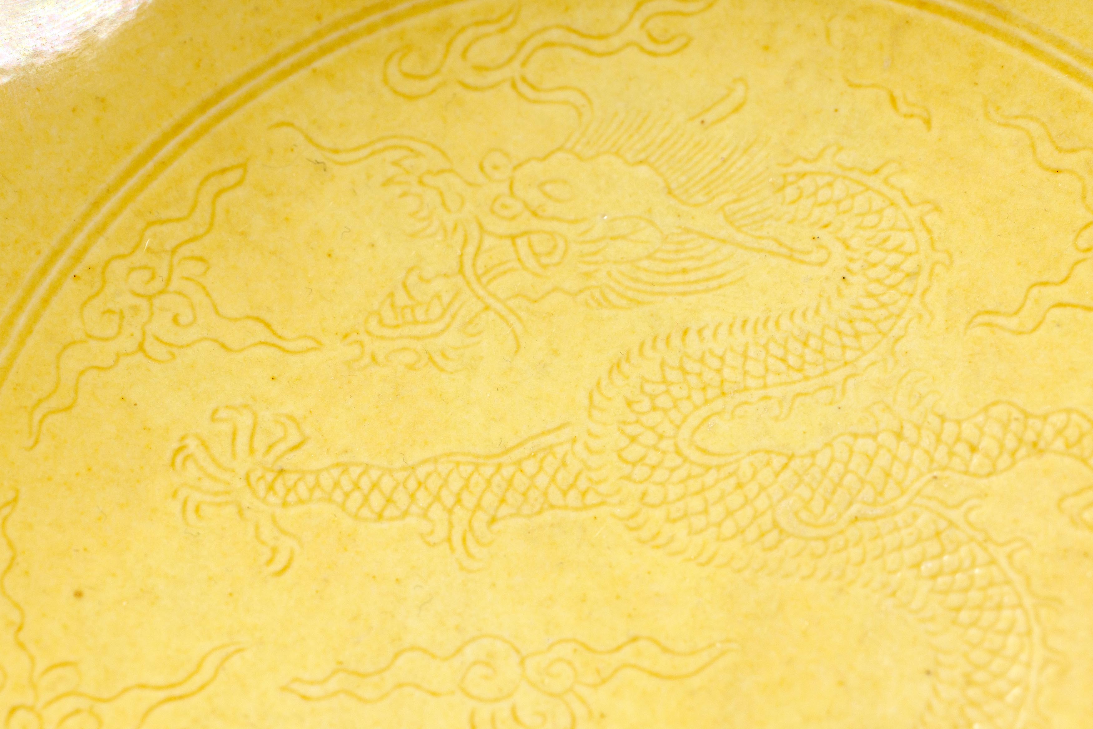 A Chinese yellow glazed 'dragon' dish Qing dynasty, Daoguang mark and period The deep dish with... - Image 6 of 7