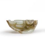 A Chinese celadon jade 'cat on leaf' carving Qing dynasty, 19th century Carved with a recumbent...