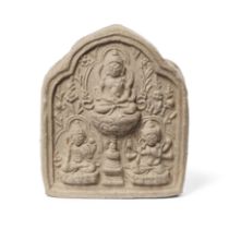 A small Tibetan clay votive plaque, tsatsa Early Ming dynasty, 14th/15th century Moulded with a...