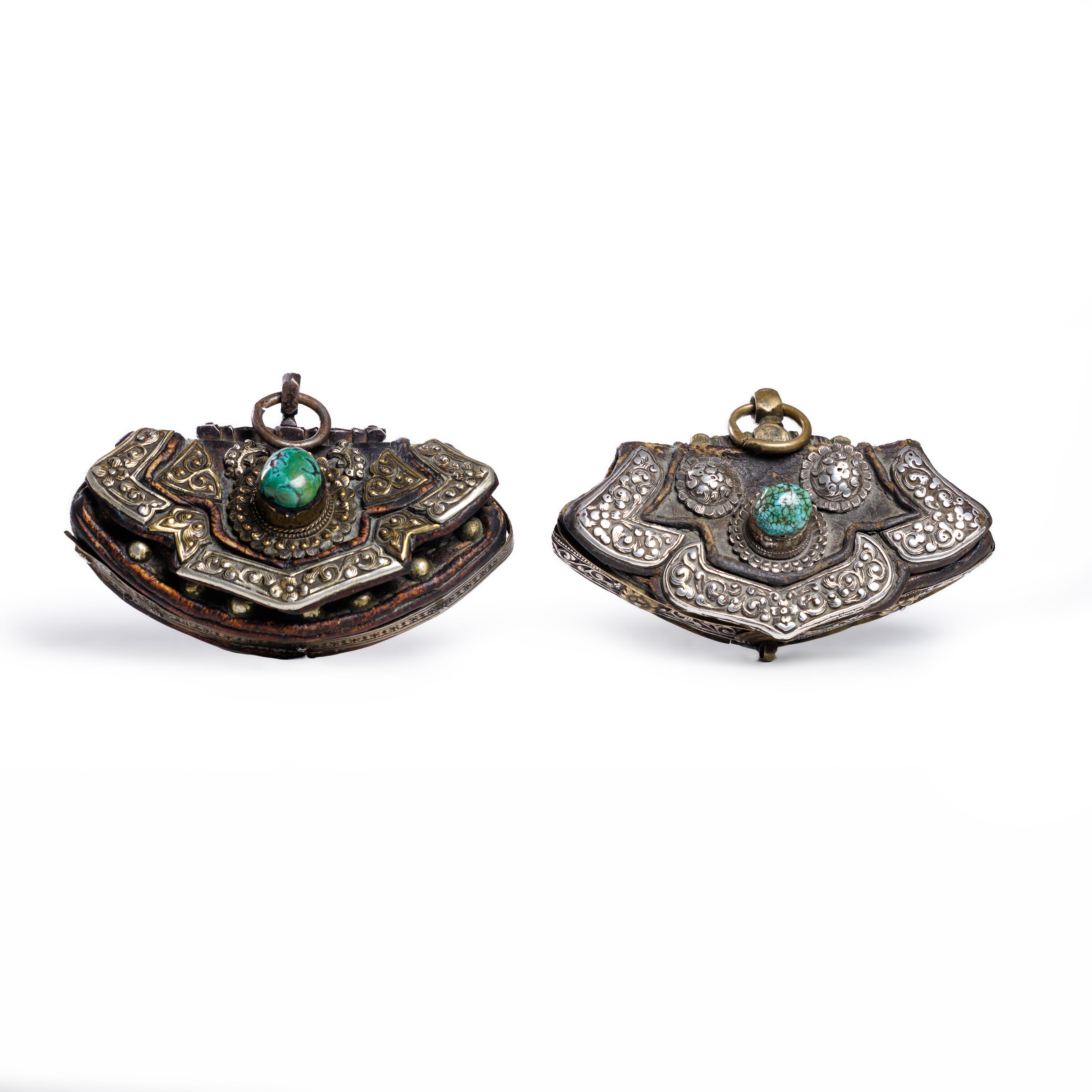 Two Tibetan silver mounted leather pouches 18th/19th Century Comprising a pouch mounted with tw...