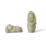 Two Chinese jade carvings of boys Qing dynasty, 19th century The first, a white jade carving of...