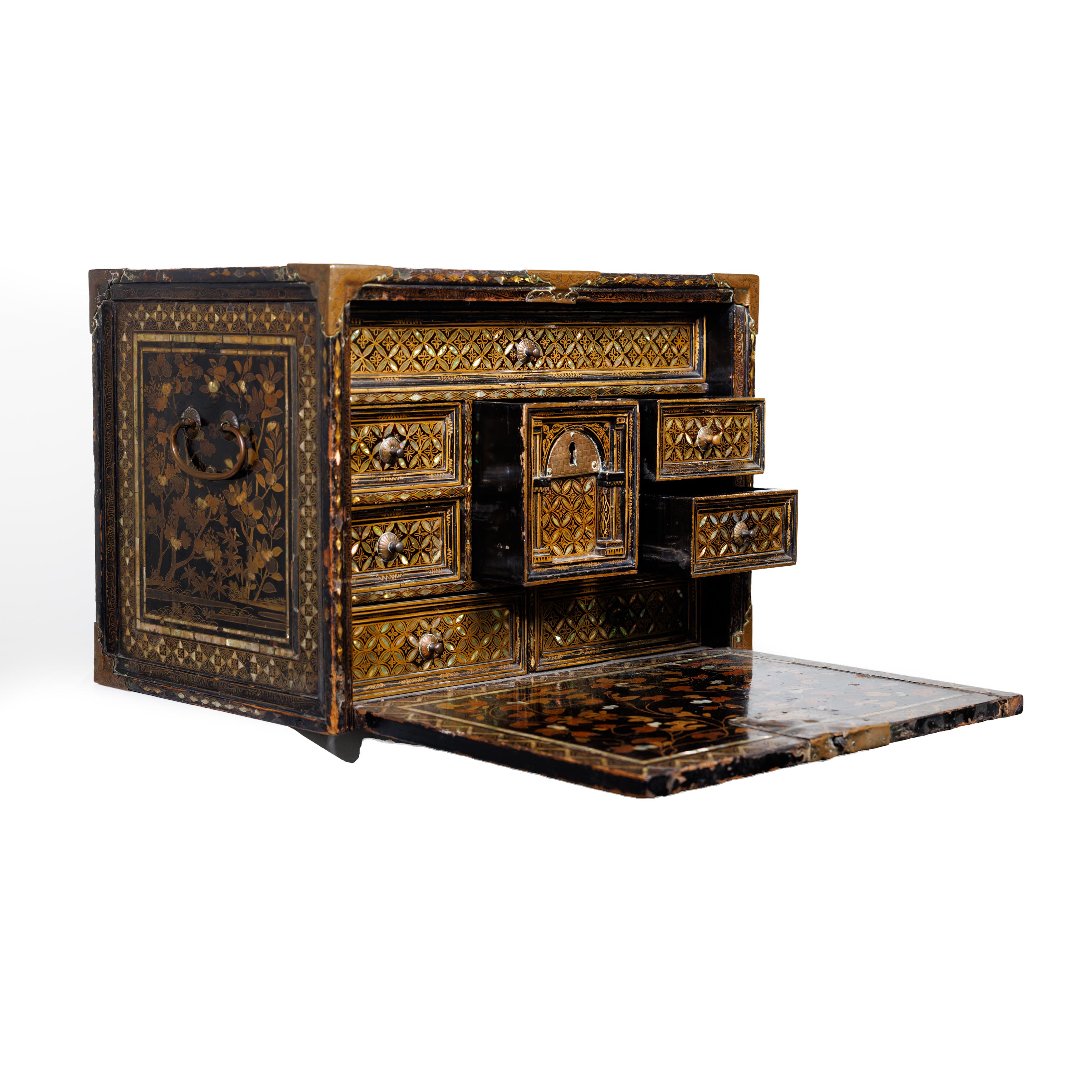 A Japanese Namban black lacquered, mother of pearl inlaid and gilt decorated cabinet Momoyama pe...